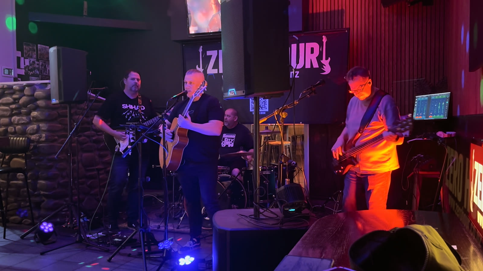 Zero Hour mid-set under blue lights at The Rock